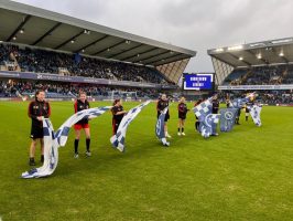 Carrying the flags into the Lions Den